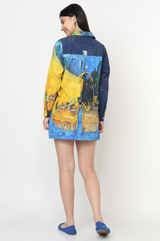 Woman wearing a colorful jacket with artistic design on a white background