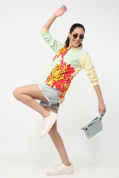Woman wearing a colorful floral dress with a white background