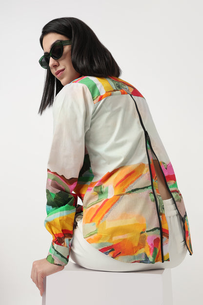 Woman wearing a colorful floral jacket on a white background