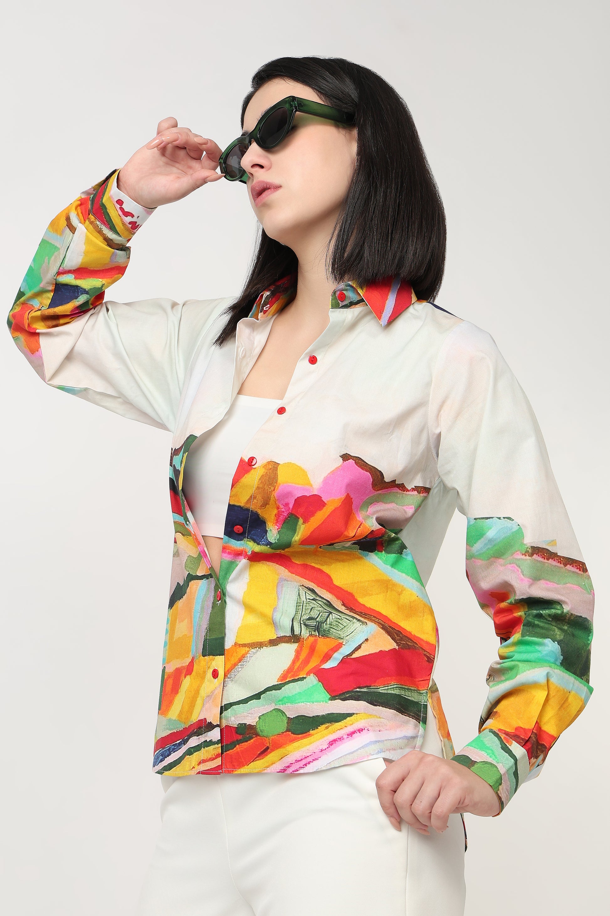 Person wearing a colorful jacket with abstract patterns on a white background