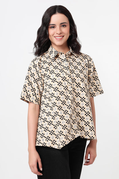Woman wearing a patterned shirt on a white background