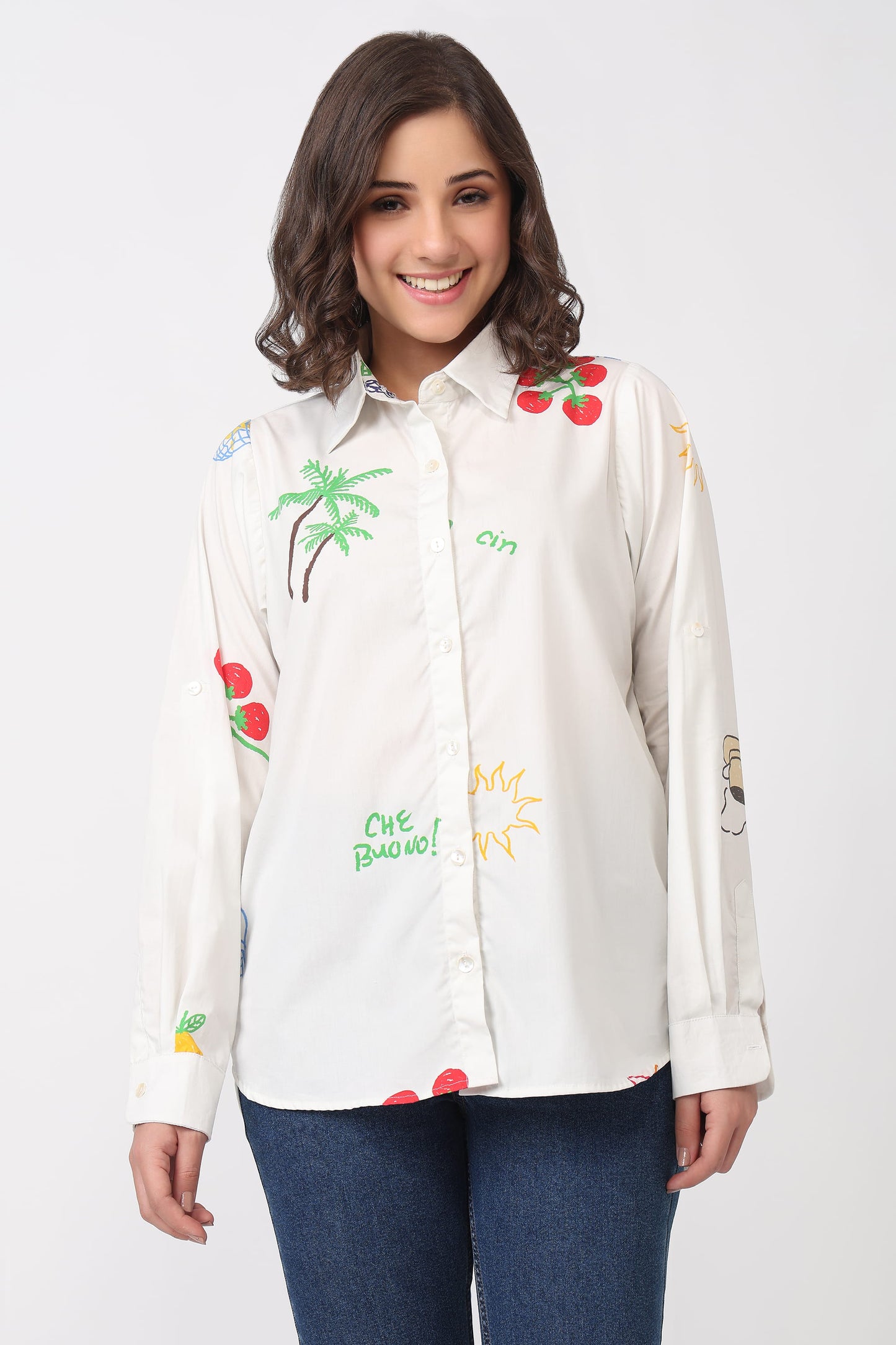 Woman wearing a white shirt with colorful embroidery print on a white background
