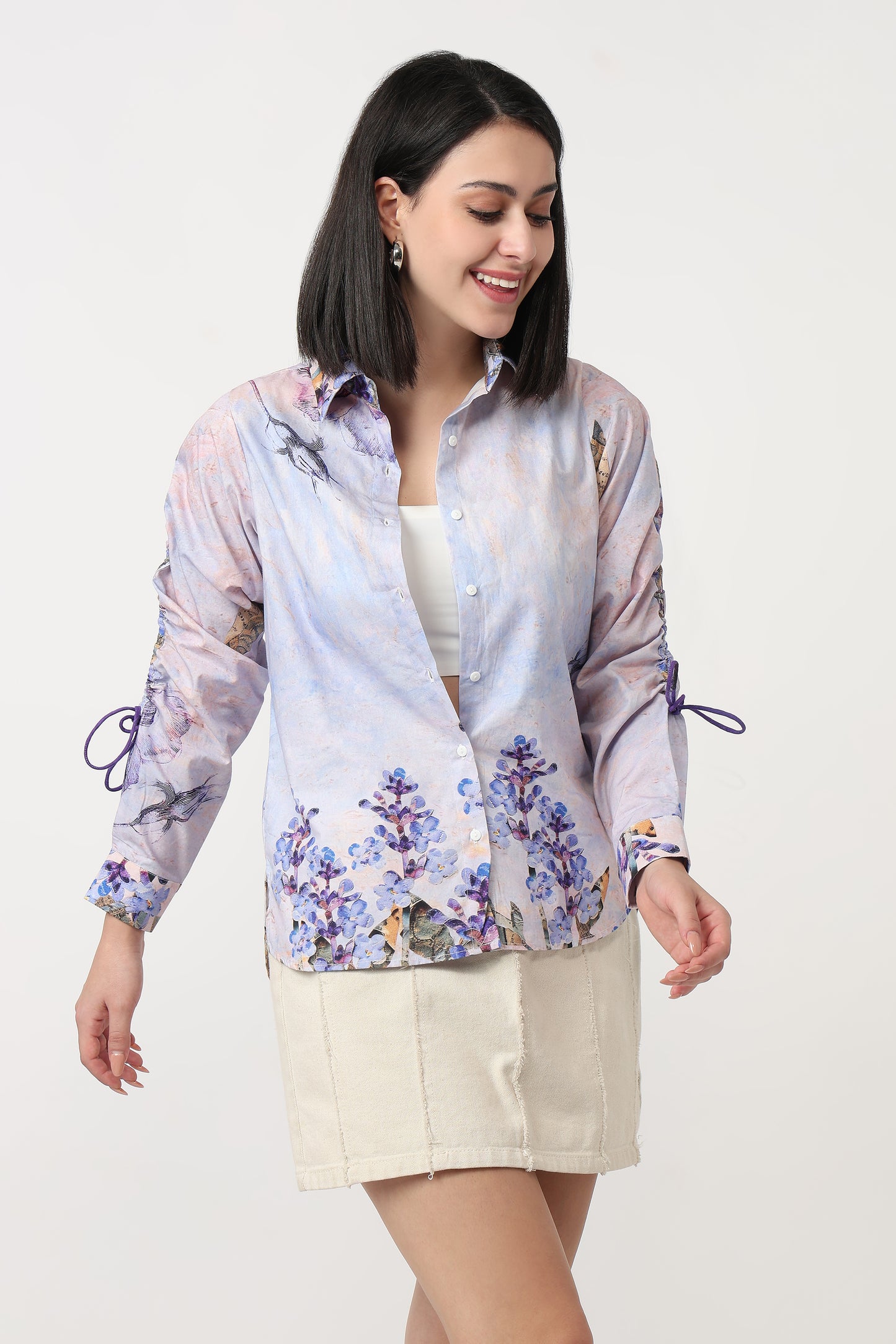 Woman wearing a floral blouse with a white background
