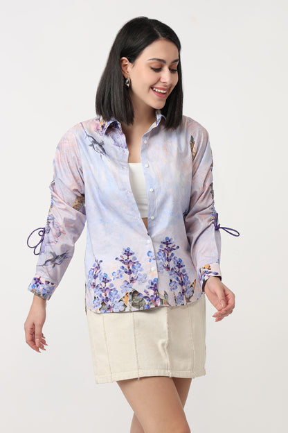Woman wearing a floral blouse with a white background