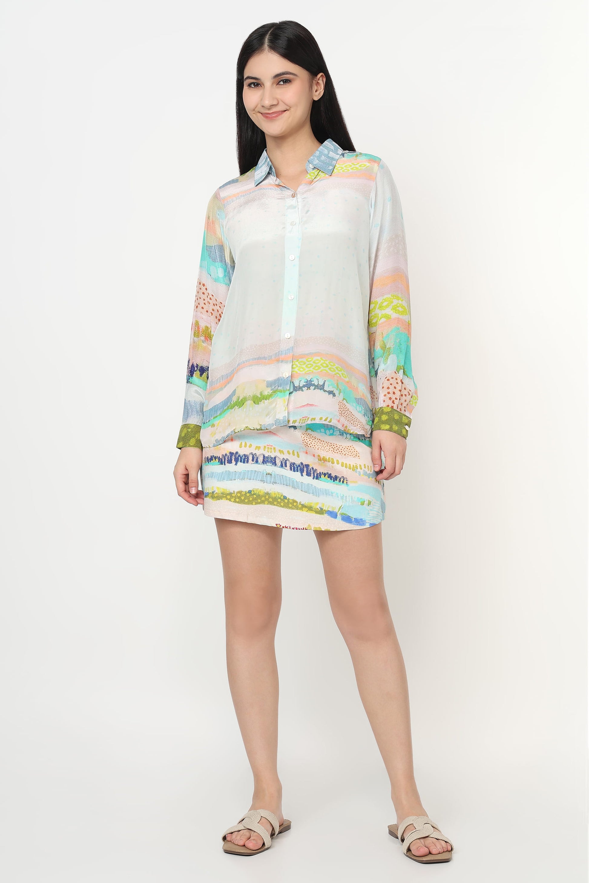 Woman wearing a colorful dress with a white background