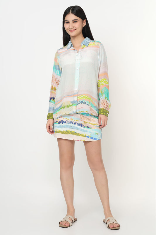 Woman wearing a colorful dress with a white background