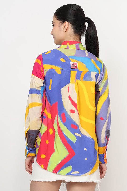 Person wearing a colorful jacket with abstract patterns on a white background
