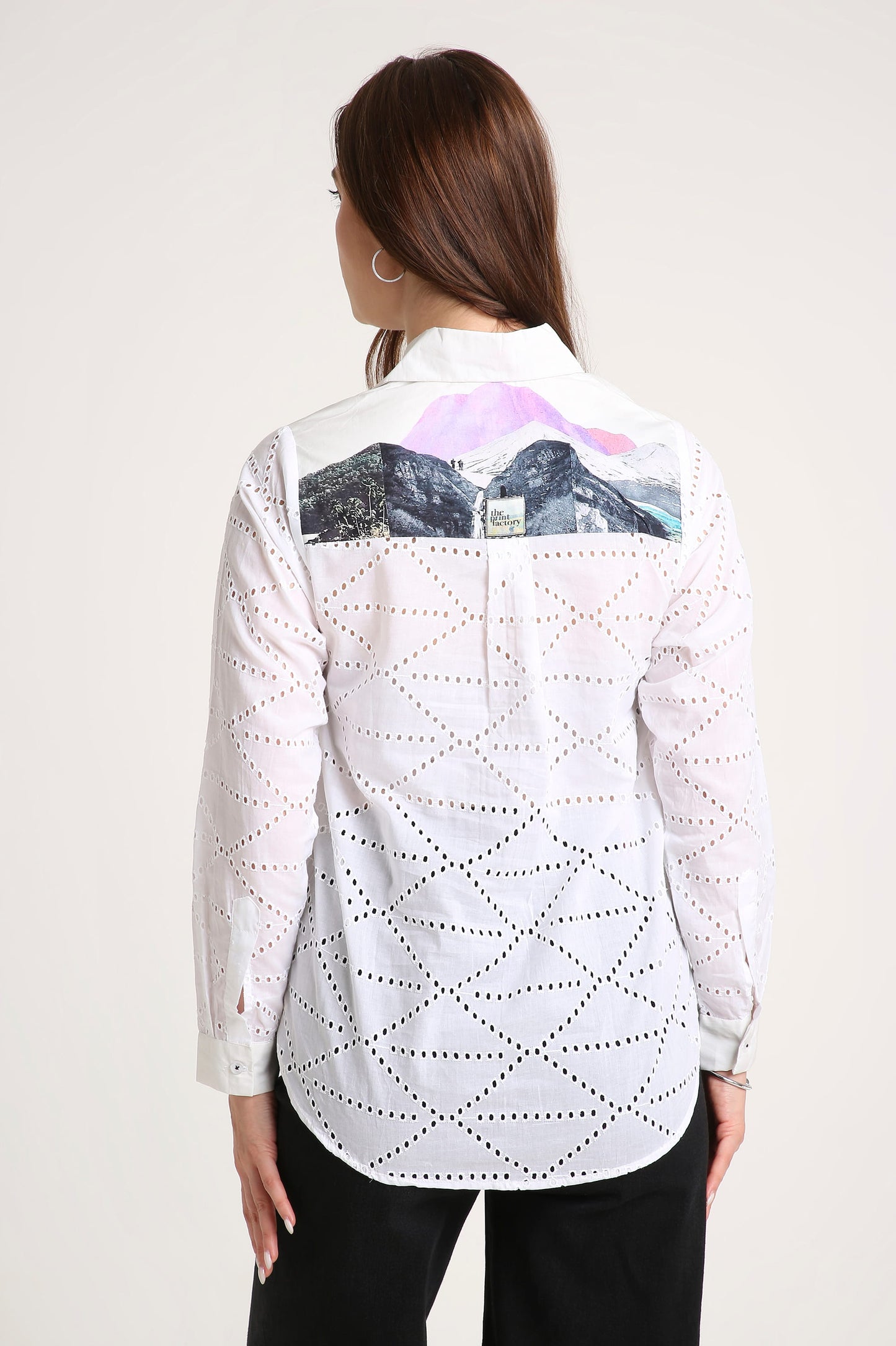 White shirt with black geometric pattern on a white background