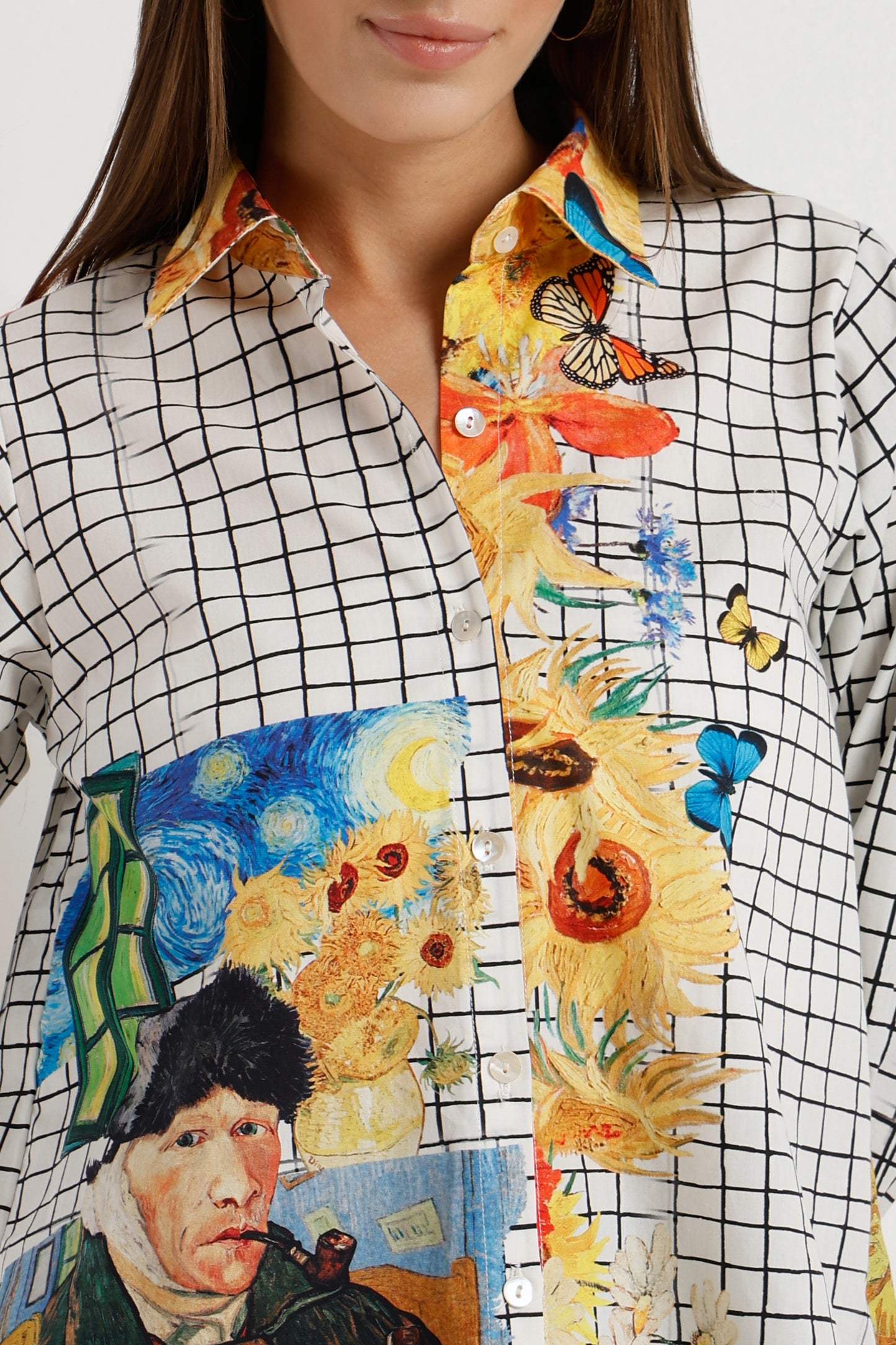 Person wearing a shirt with artistic designs including Van Gogh's 'Sunflowers' and 'Self-Portrait'.