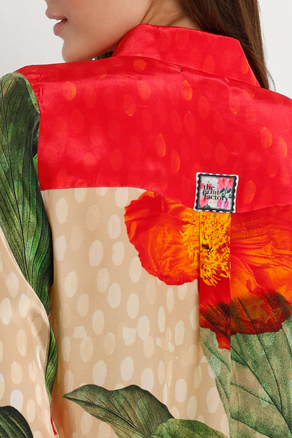 Close-up of a colorful garment with floral patterns and a visible brand label.