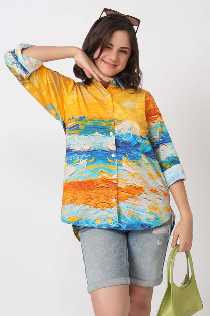 Woman wearing a colorful shirt with abstract design on a plain background