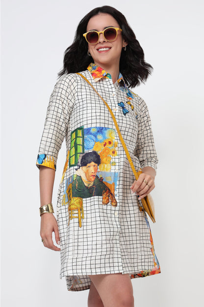 Woman wearing a colorful dress with artistic designs on a white background