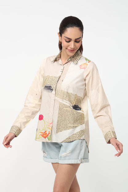 Woman wearing a patchwork shirt with floral and abstract designs on a white background