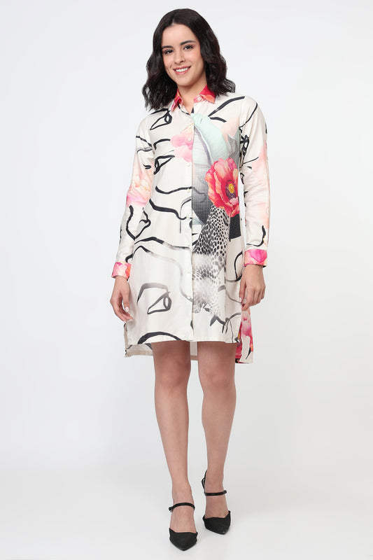 Woman wearing a floral and abstract patterned dress on a white background