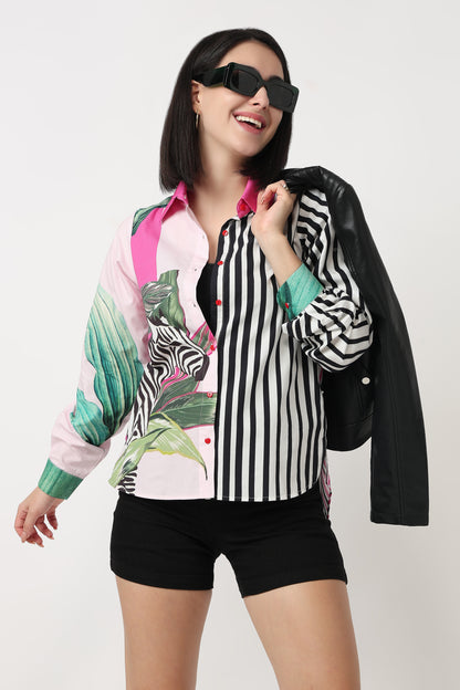 Woman wearing a colorful shirt with zebra pattern, black shorts, and sunglasses on a white background